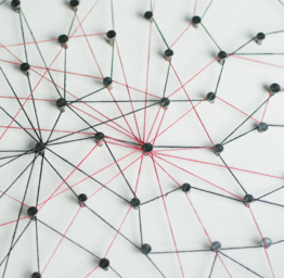 Connecting networks. two network connected with yarn red and blue on white paper. Simulator connection social media, internet, people communication